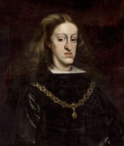 The guy with the overextended lower jaw is Carlos II of Spain, whose inability to father children and death began the War of the Spanish Succession